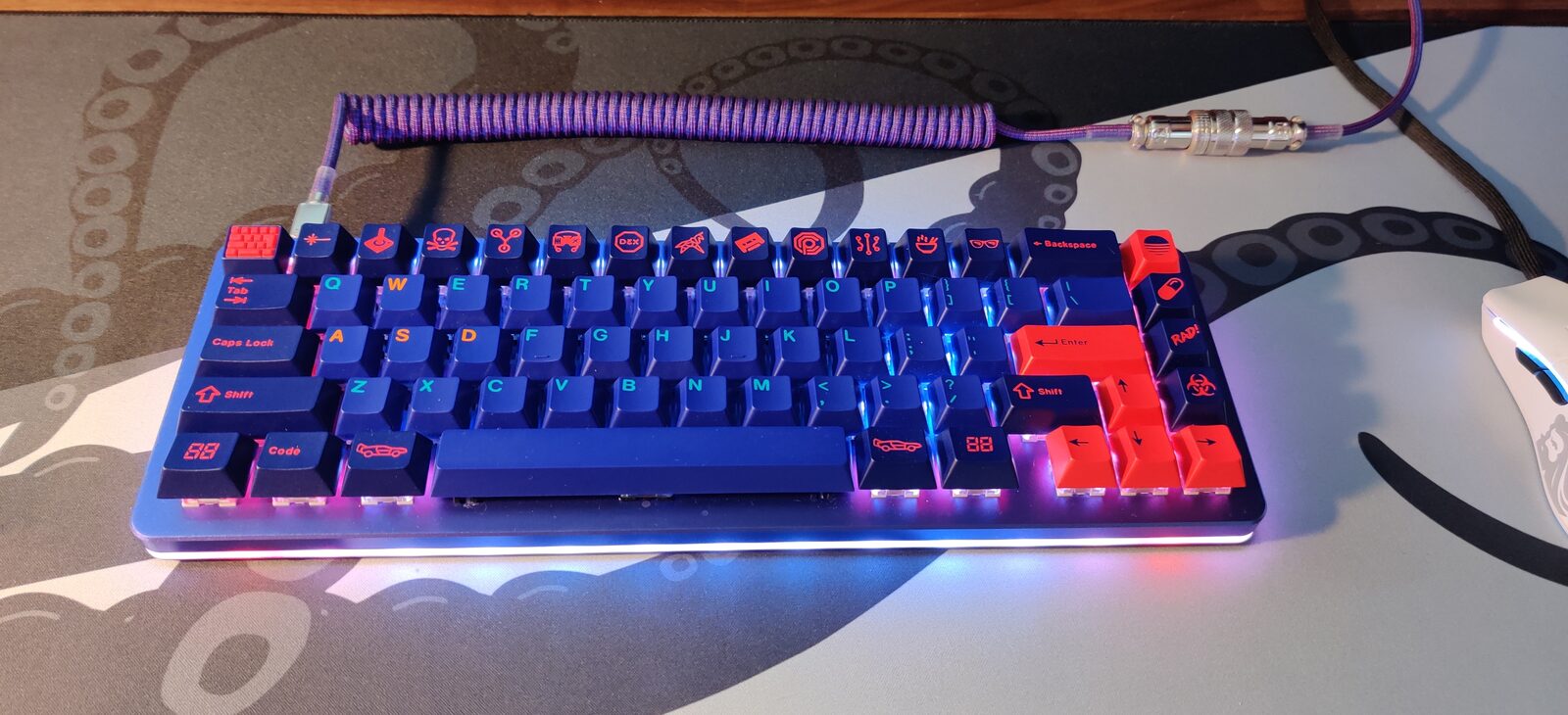 Custom keyboard with RGB underglow and cyberpunk keycaps