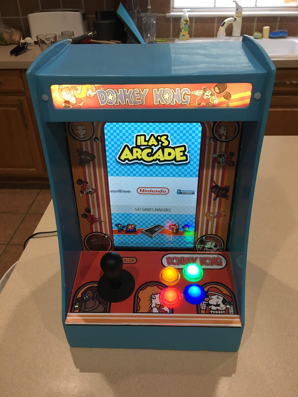 The finished bartop on the counter with its custom marquee and side art