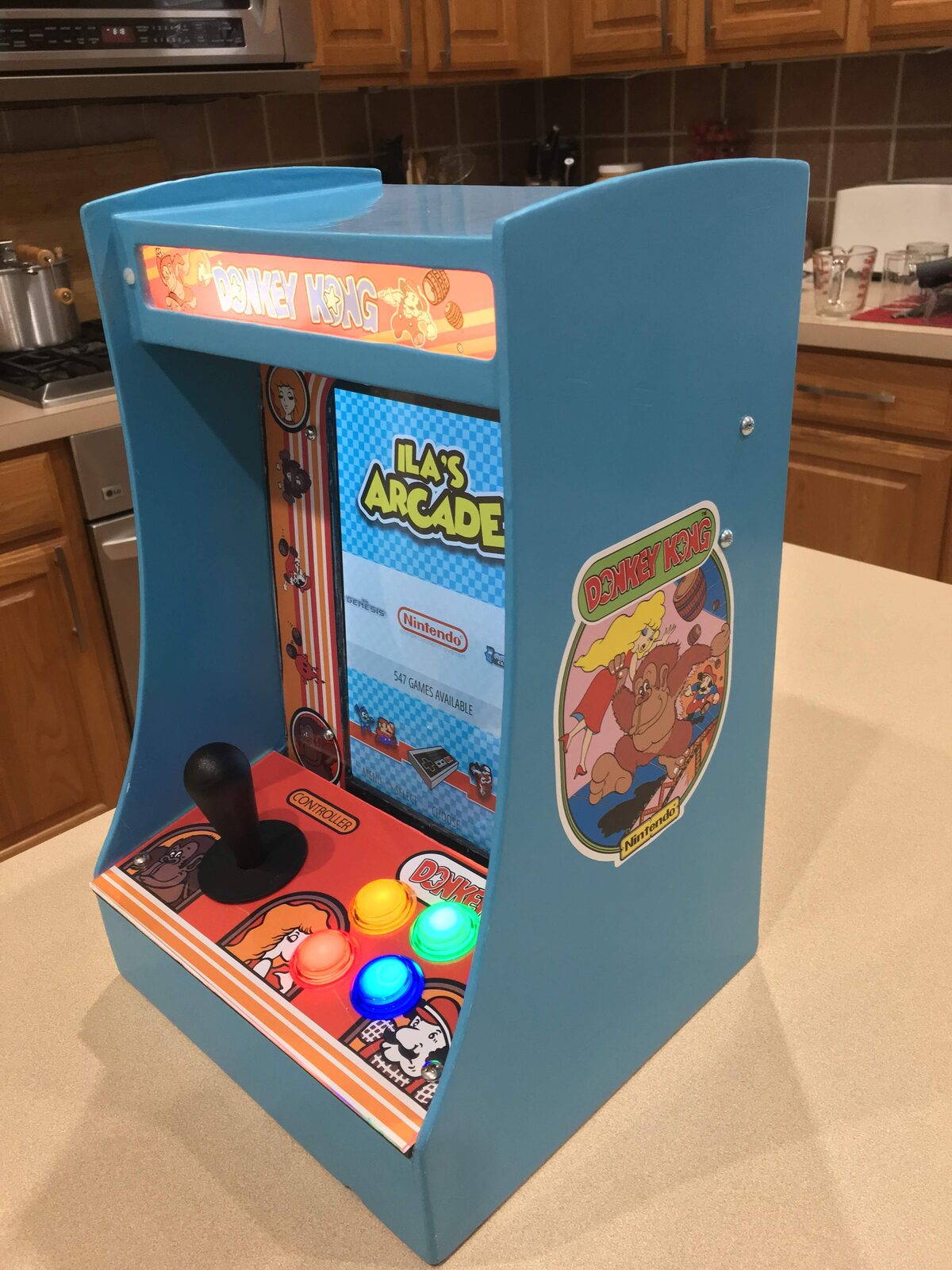 A side view of the finished cabinet showing its arcade artwork