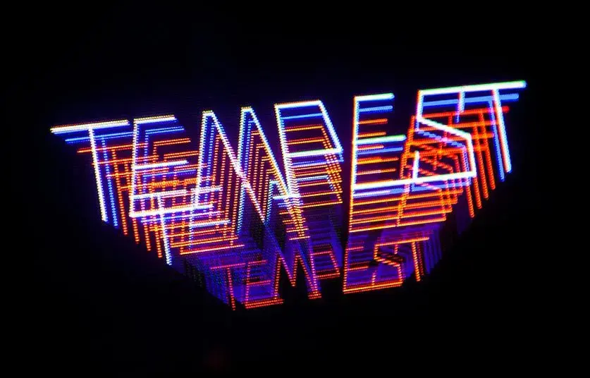 The restored cabinet running Tempest, the glowing attract-mode title screen on the vector monitor