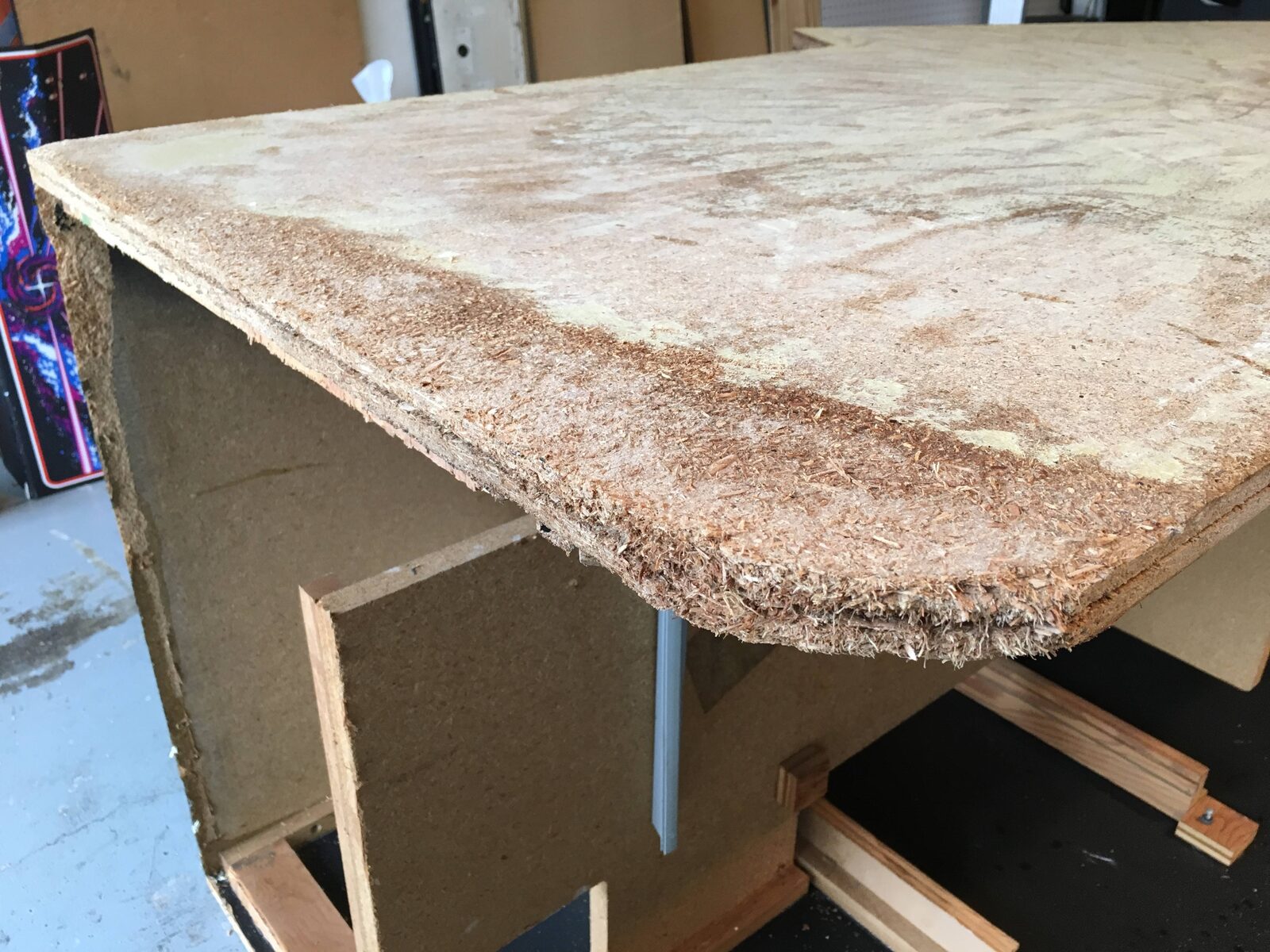 A repaired cabinet panel with its edges rebuilt