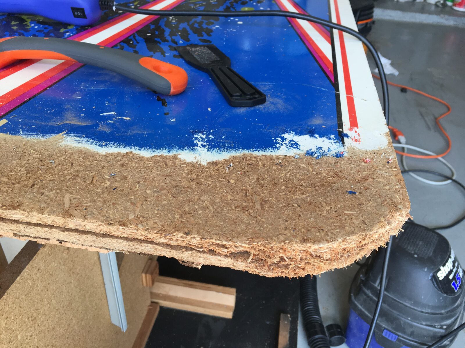 A side panel with its old art half stripped away