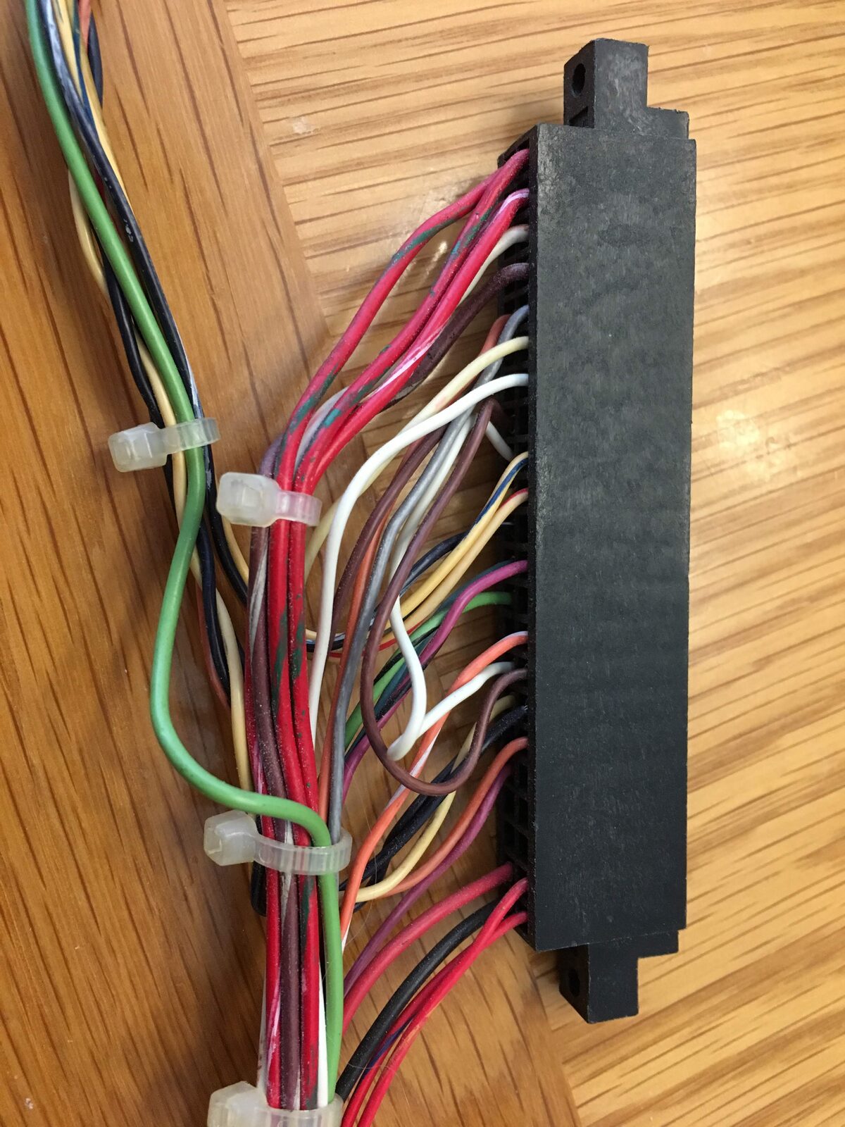 A rewired edge connector for the cabinet wiring harness
