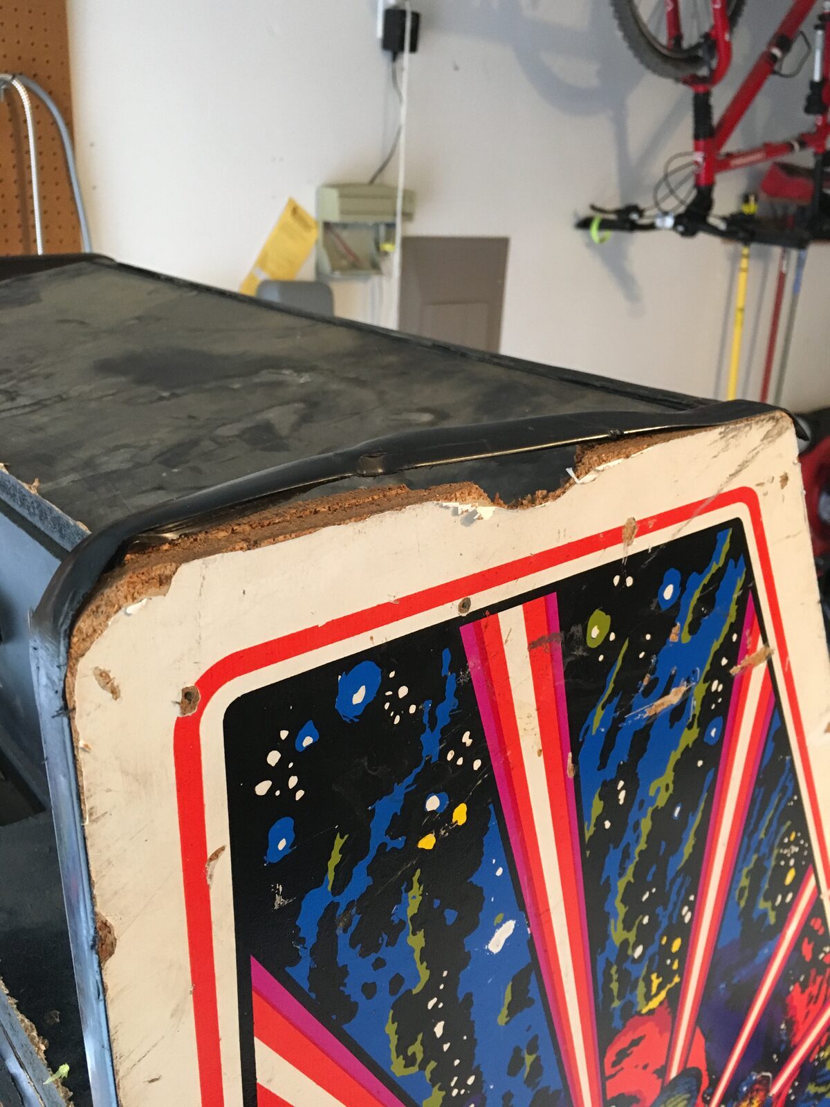 The original faded and worn Tempest side art before restoration